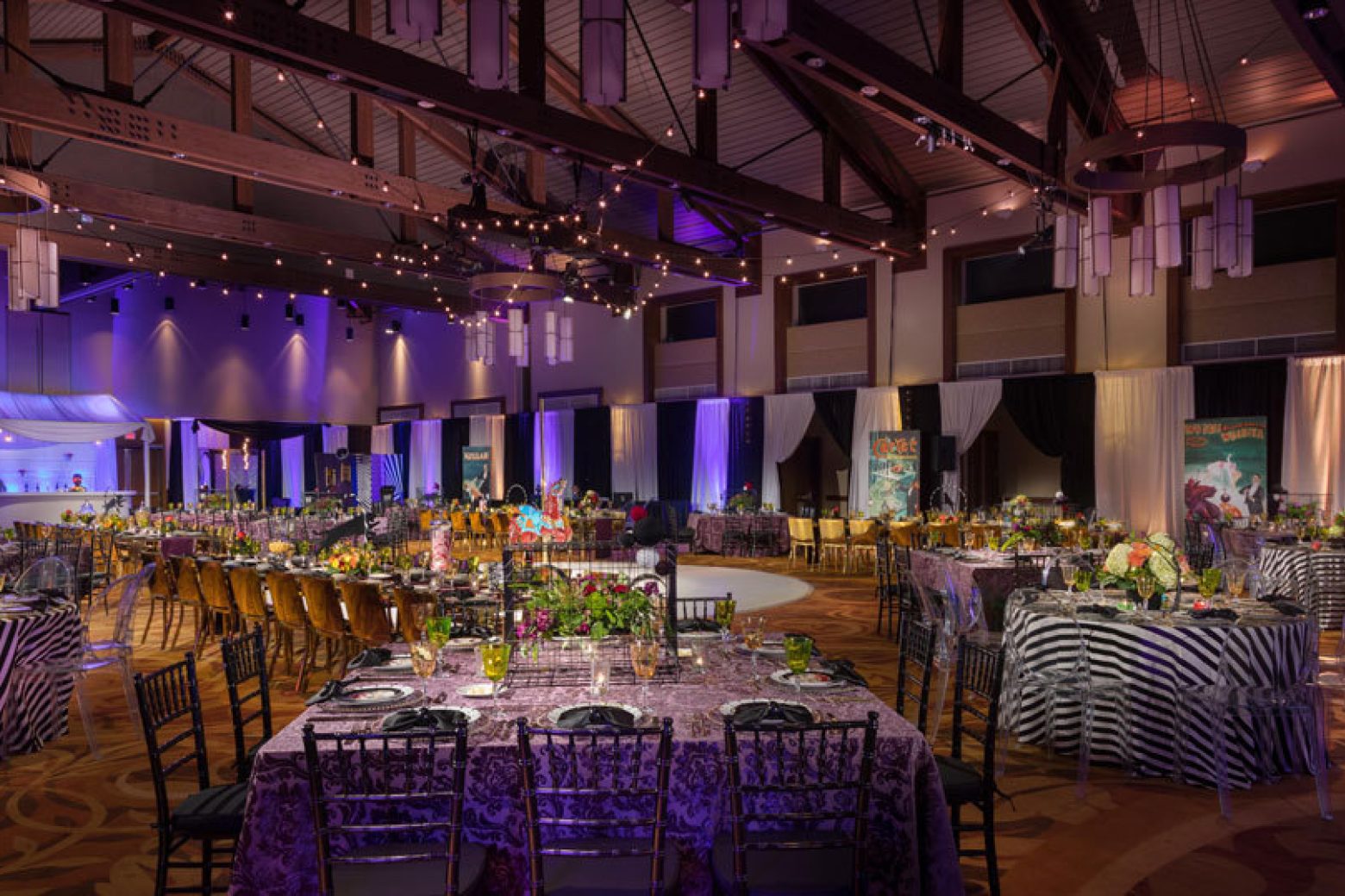 a large banquet hall with tables and chairs set for a meal